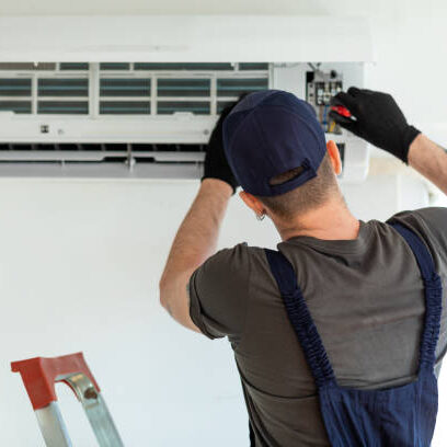 Technician repairing air conditioner